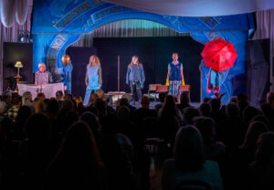 The four women from We're Not Going Back on stage at The Grove Hall with a packed audience